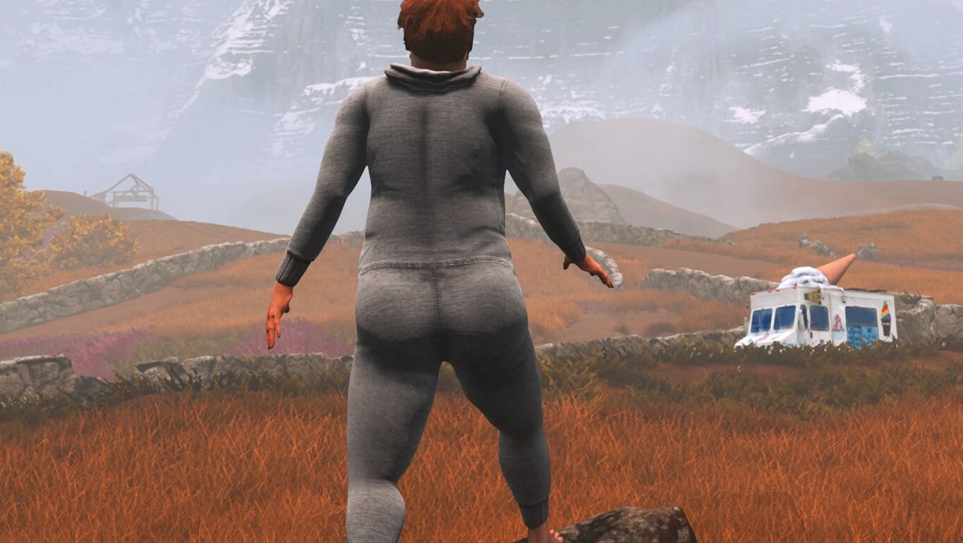 A man walks through a field.