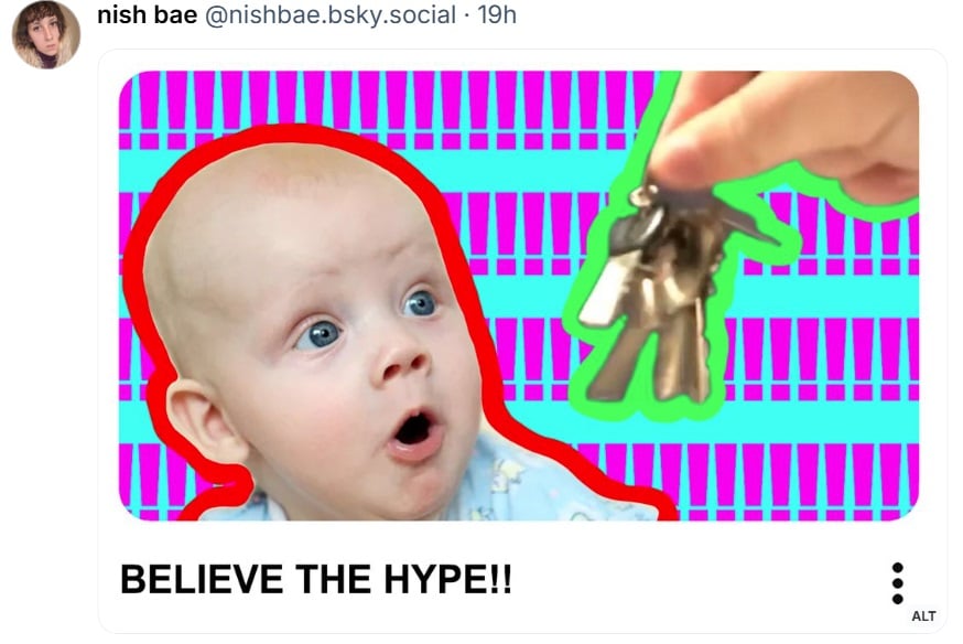 A baby looks at keys. 