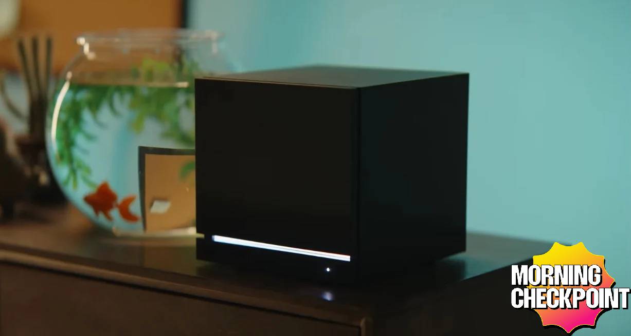 A Steam Machine sits on a desk.