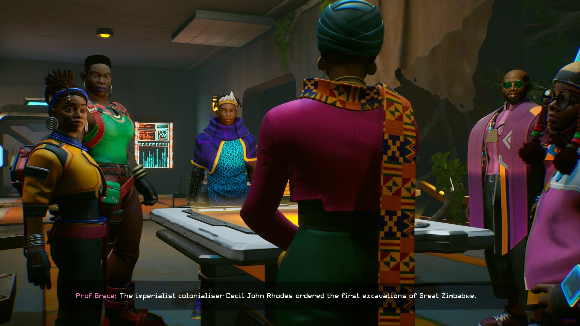 Screenshot from Relooted featuring the team surrounding a table as an old woman says, "The imperialist colonizer Cecil John Rhodes ordered the first excavations of the Great Zimbabwe."