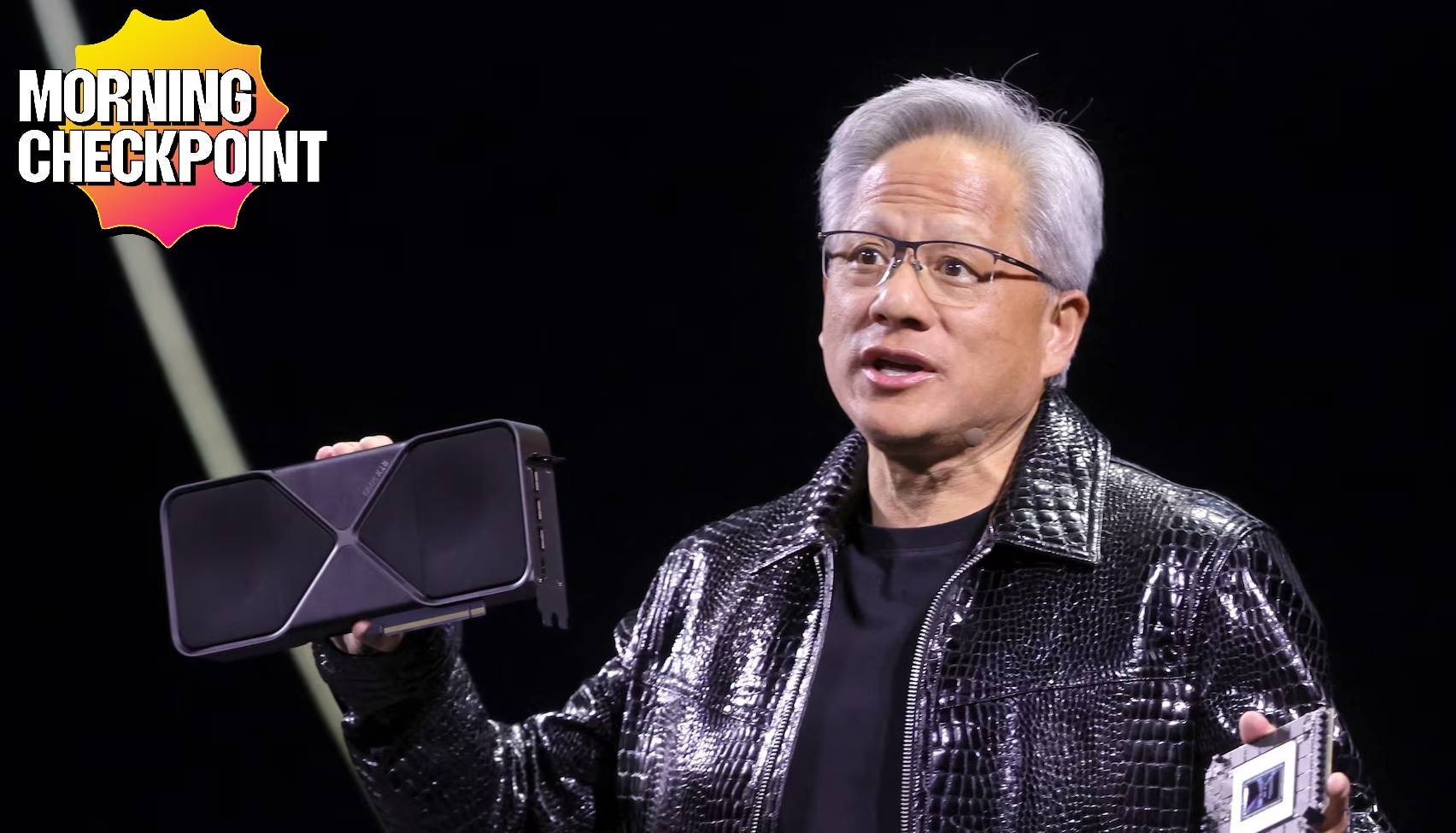Nvidia's CEO holds up a GPU.