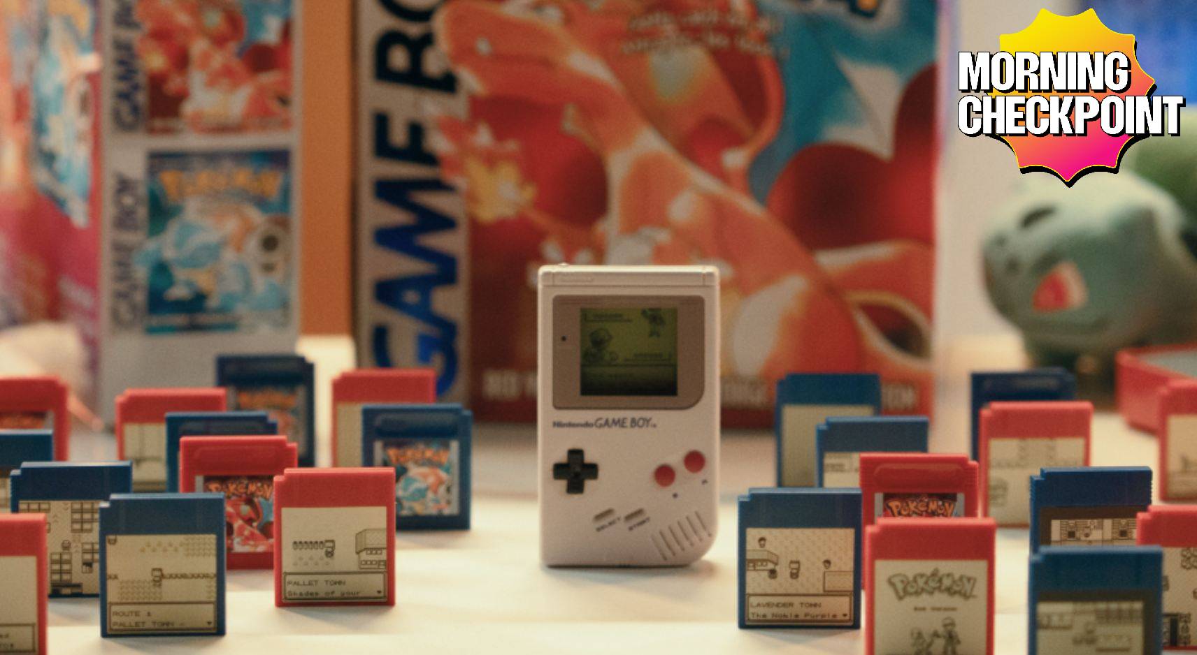 A Game Boy sits in front of copies of Pokémon Red and Blue.