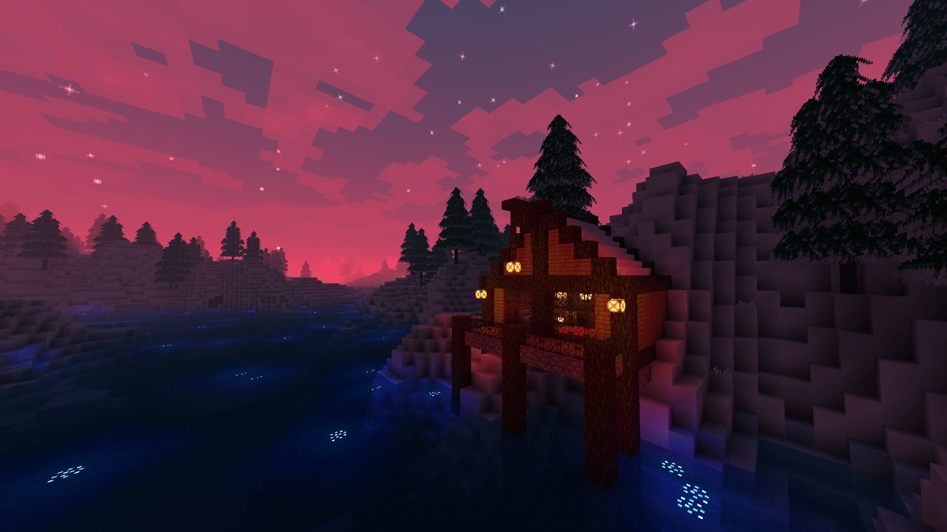 A voxel house sits near a cliff at sunset.