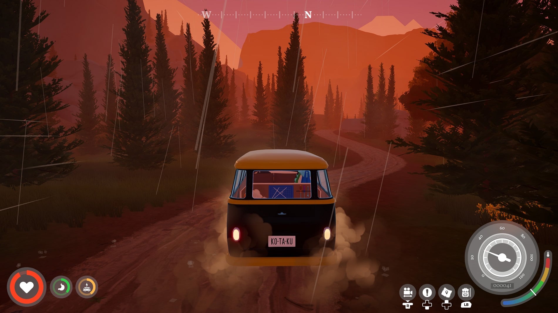 A VW van drives through the rain.