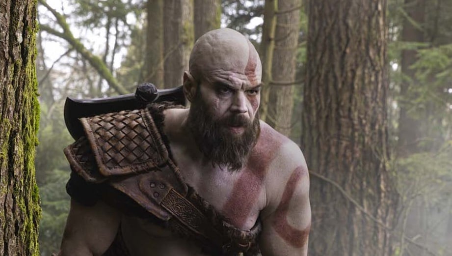 Kratos stares in the woods.