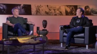 Pete Hines speaks with Phil Spencer on stage.