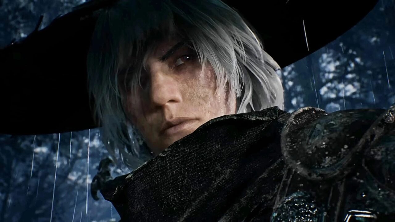 A man wears a hat in the rain.