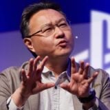 Shuhei Yoshida talks on stage at a PlayStation even.