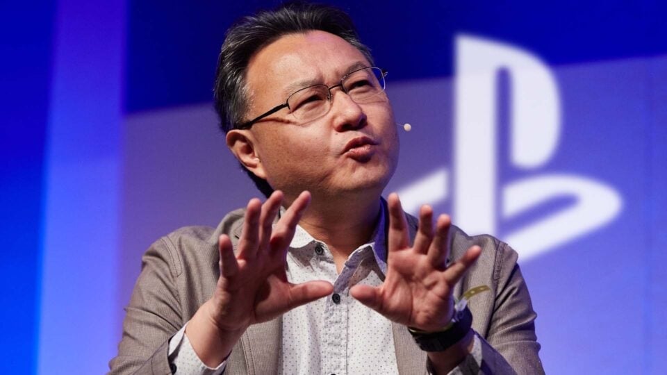 Shuhei Yoshida talks on stage at a PlayStation even.
